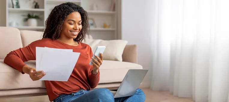 Injured worker reviewing claim documents at home, showing how Work Injury Law Group helps overturn denied workers compensation claims in California.