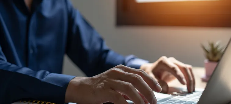 Legal professional working on workers compensation case files representing injured employees seeking guidance from workers compensation attorney California.