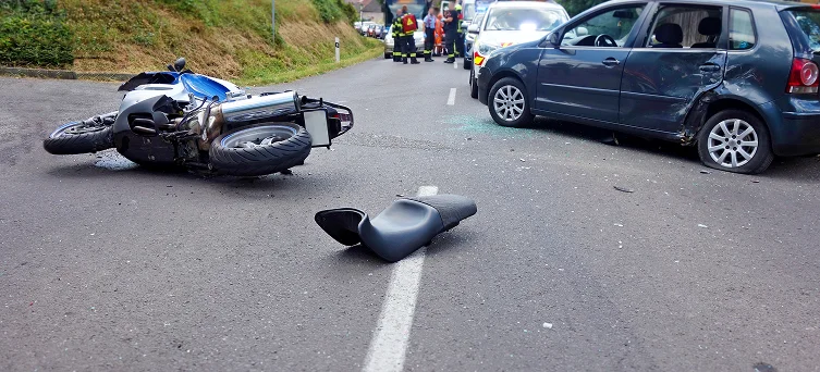 Motorcycle crash scene with damaged bike and emergency responders representing serious accident claims handled by motorcycle accident lawyer Los Angeles.