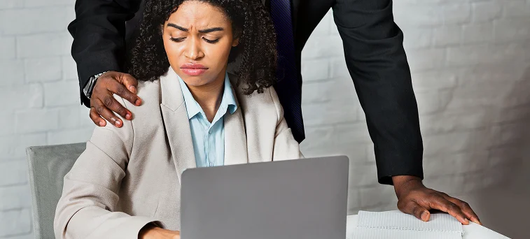 Female employee experiencing workplace sexual harassment from supervisor, representing cases handled by Los Angeles workplace sexual harassment lawyer and employment law attorney.