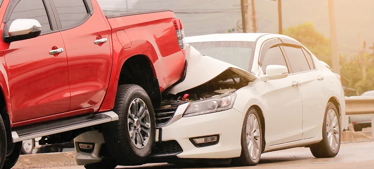 Pickup truck and sedan collision scene representing serious auto accident cases handled by car accident attorney Los Angeles and personal injury lawyer.
