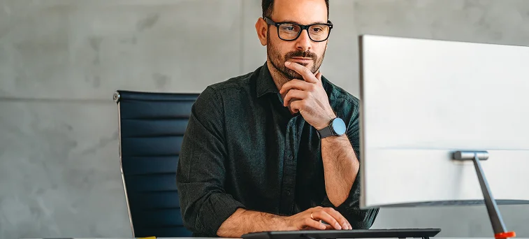 Professional reviewing documents related to delayed workers compensation claim handled by Los Angeles delayed claim lawyer.